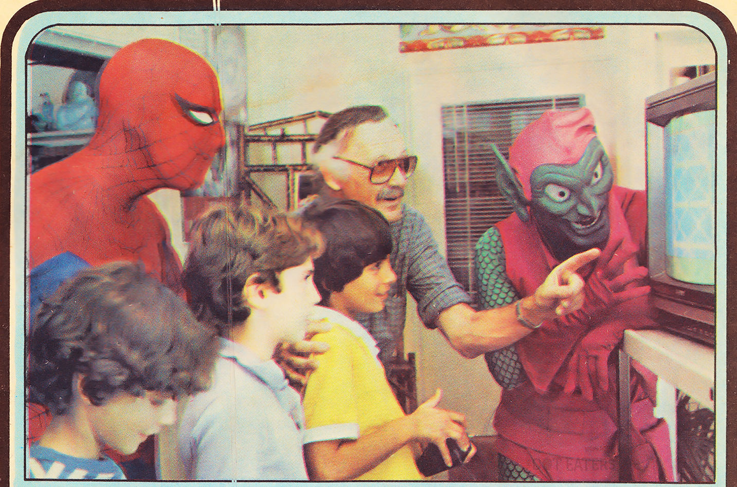 Stan Lee regals a group of kids, along with Spider-Man and Green Goblin