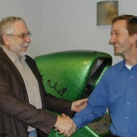 Photo of Nolan Bushnell and Pete Ashdown in front of Computer Space arcade video game